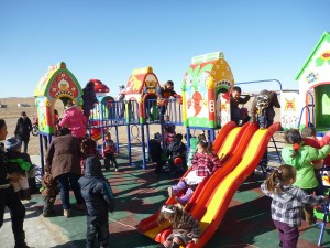 Children playing at the new playground in Matad Soum